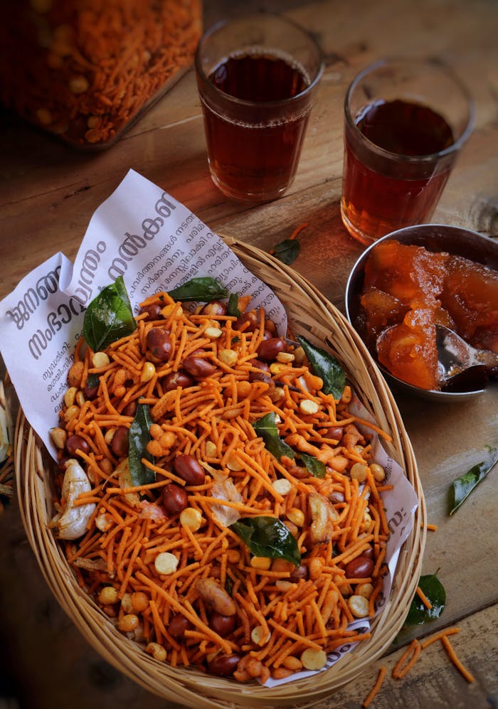 heros-img A tempting mixture of Indian snacks with drinks, showcasing vibrant textures and flavors.